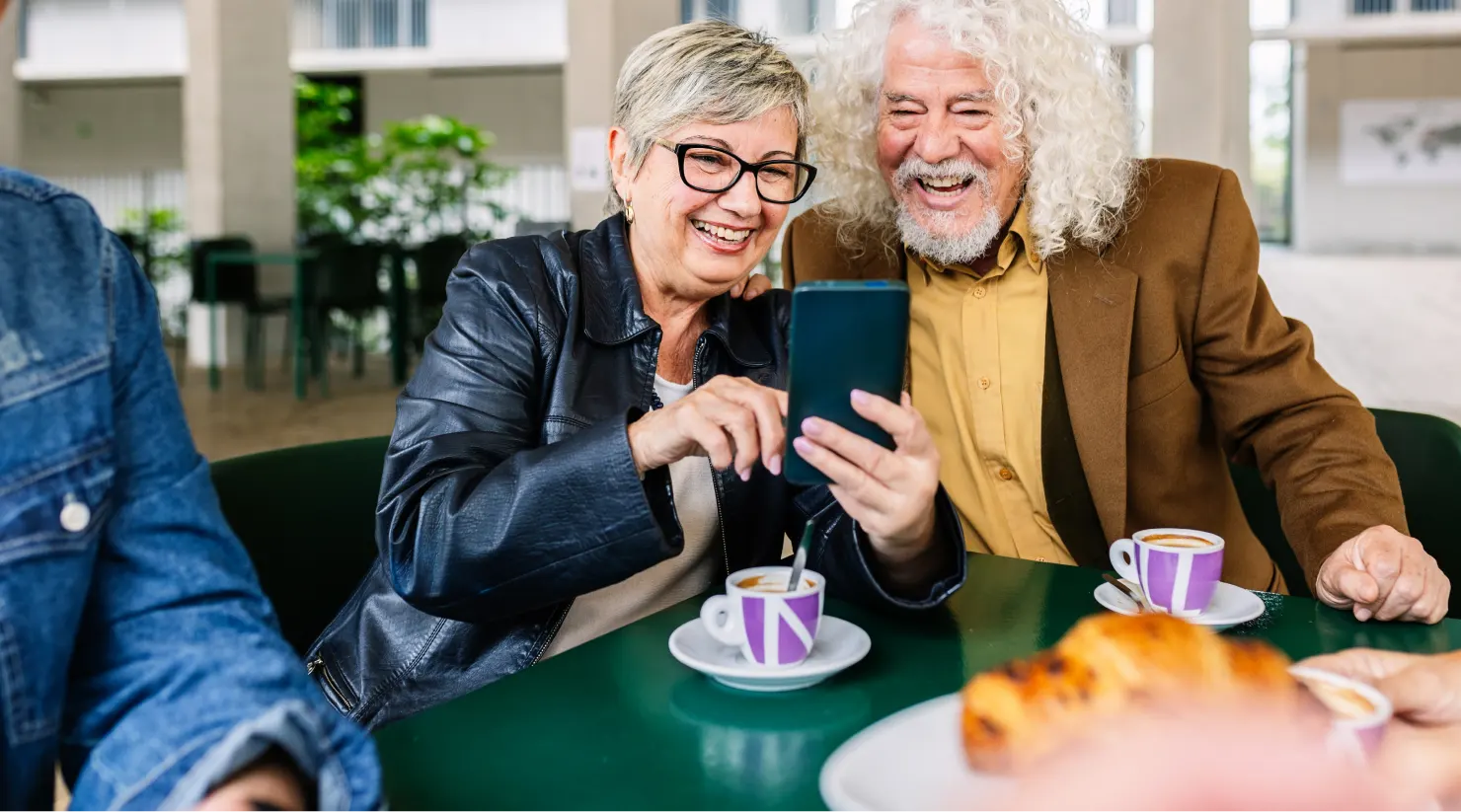 happy-senior-couple-of-pensioners-using-mobile-phone